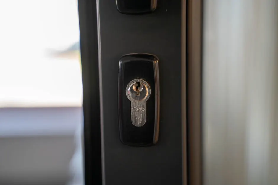 Detailed view of a steel keyhole on a door ensuring security and privacy.